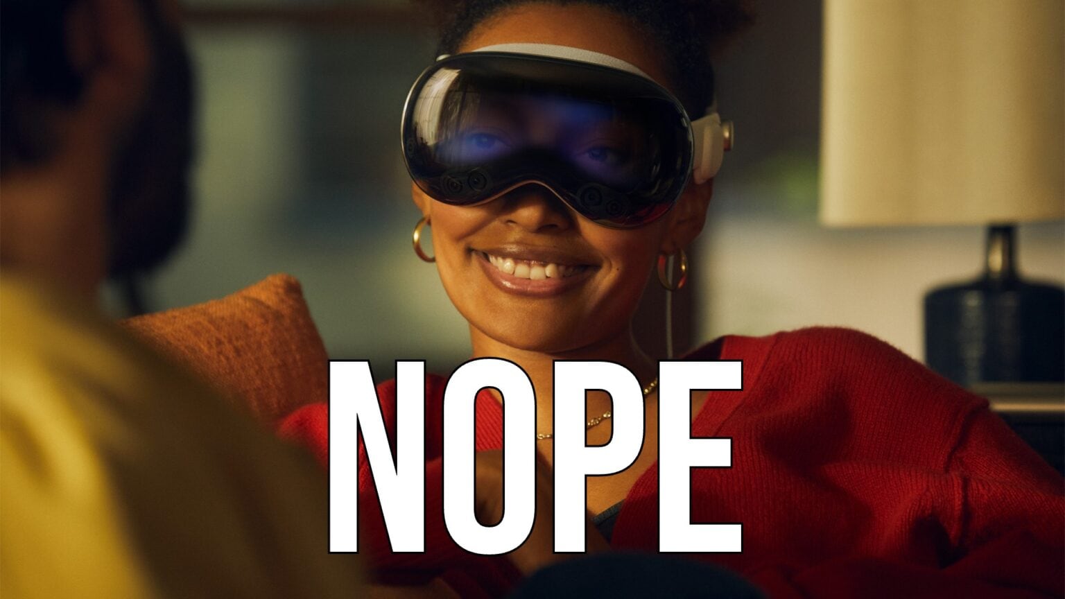 An Apple Vision Pro headset promotional image with the word 